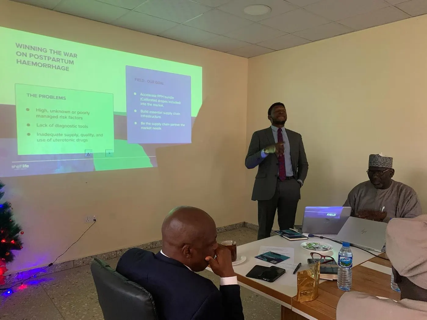 Tobey presenting safe motherhood materials to the State SIHCSS Steering Committee at Plateau State Drugs and Medical Commodities Management Agency