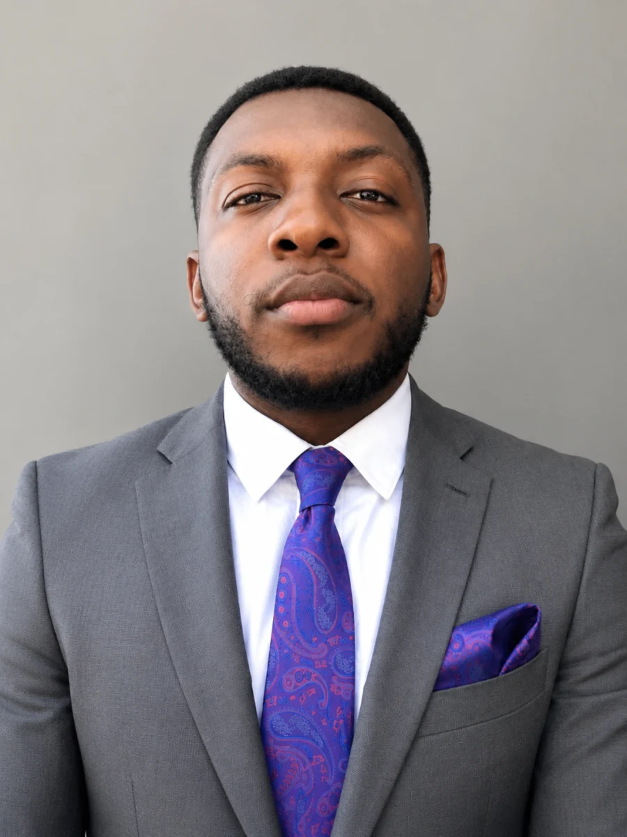 Portrait of Tobechukwu Okafor in a suit and tie